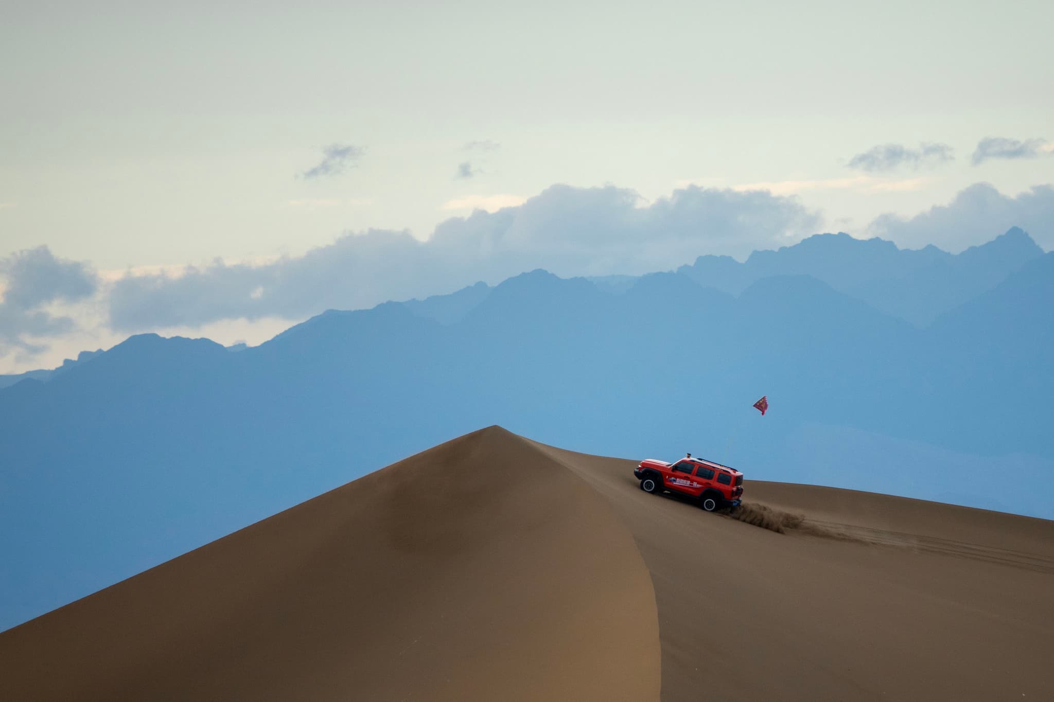 SUV Conquering the Dunes