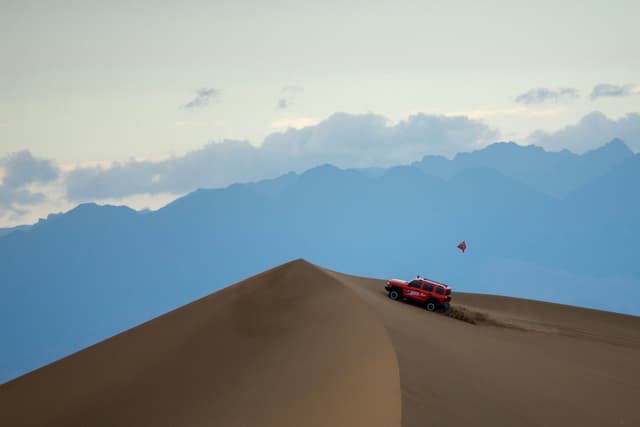 SUV Conquering the Dunes